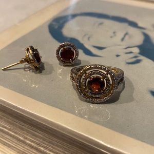 Ring and matching earrings. Costume jewelry- garnet colored glass stones.